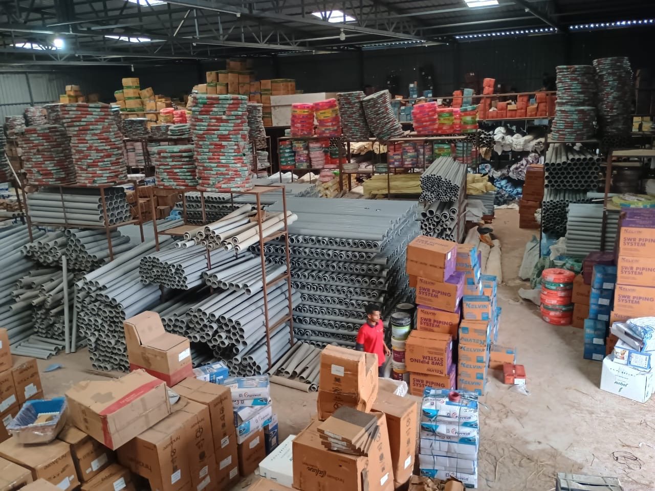 Shreya Polymers warehouse inventory with pipes and packaged products